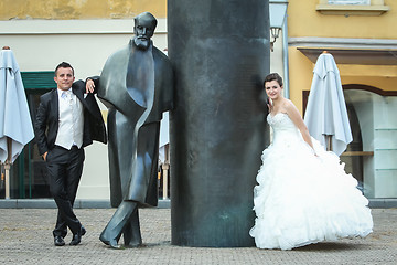 Image showing Newlyweds leaning on August Senoa Monument