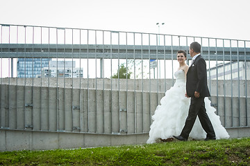Image showing Newlyweds walking in city