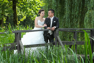 Image showing Bride and groom looking at each other in nature