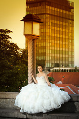 Image showing Bride posing next to street lamp