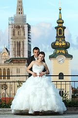 Image showing Bride and groom posing in city