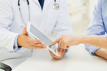 Image showing close up of male doctor and patient with tablet pc
