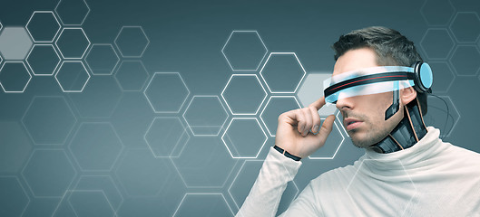 Image showing man with futuristic 3d glasses and sensors