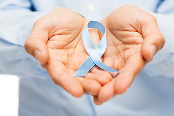 Image showing hands with blue prostate cancer awareness ribbon