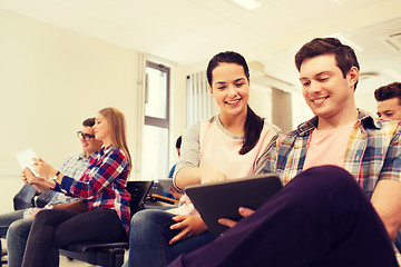 Image showing group of smiling students with tablet pc