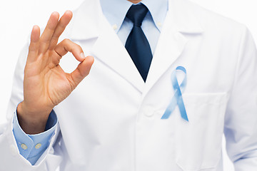 Image showing happy doctor with prostate cancer awareness ribbon