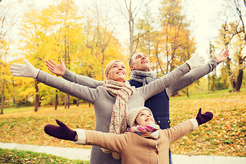 Image showing happy family having fun in autumn park