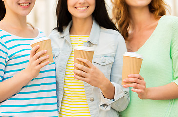 Image showing close up of happy young women drinking coffee