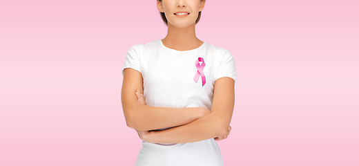 Image showing smiling woman with pink cancer awareness ribbon