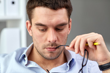 Image showing portrait of businessman with eyeglasses at office