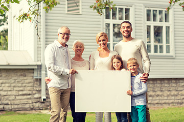 Image showing happy family in front of house outdoors