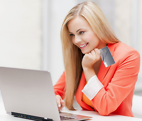 Image showing businesswoman with laptop and credit card