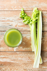 Image showing close up of fresh green juice glass and celery