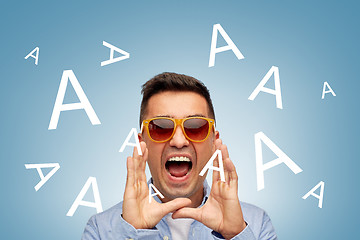 Image showing face of angry shouting a letters man in sunglasses