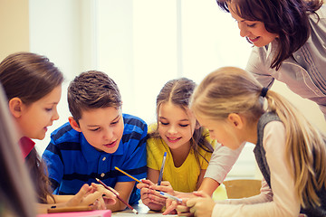 Image showing group of school kids writing test in classroom