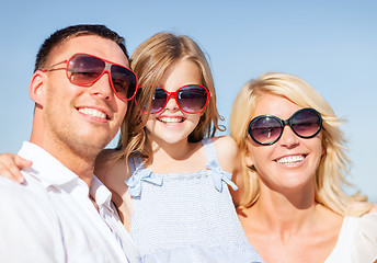 Image showing happy family with blue sky