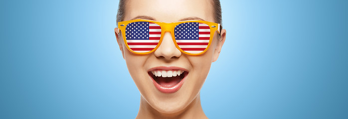 Image showing happy teenage girl in glasses with american flag