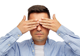 Image showing face of man covering his eyes with hands