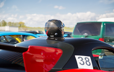 Image showing close up of car with helmet on roof top