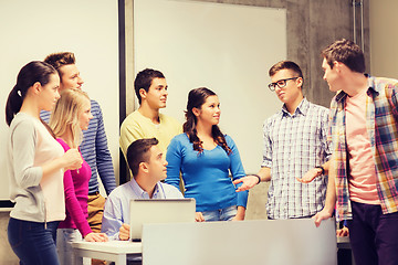 Image showing group of students and teacher with laptop