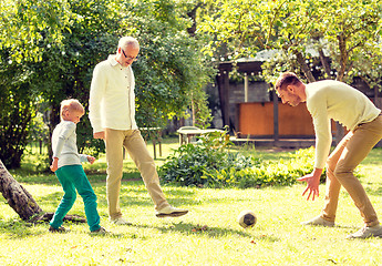 Image showing happy family playing football outdoors