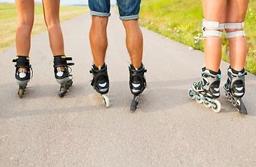 Image showing close up of legs in rollerskates skating on road