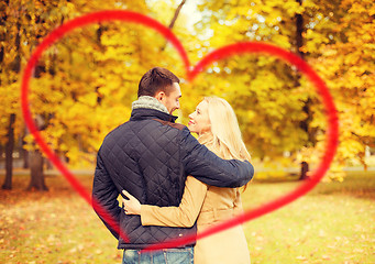 Image showing romantic couple kissing in the autumn park