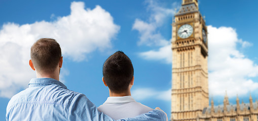 Image showing close up of male gay couple hugging over big ben