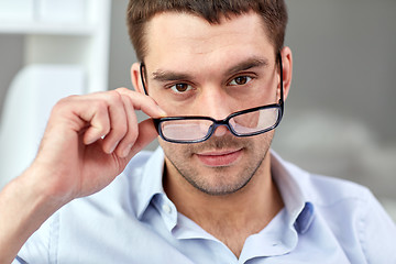 Image showing portrait of businessman in eyeglasses at office