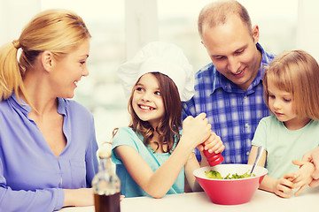 Image showing happy family with two kids eating at home