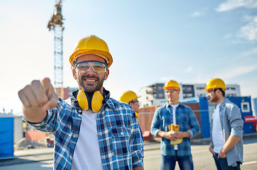 Image showing builders pointing finger at you on construction