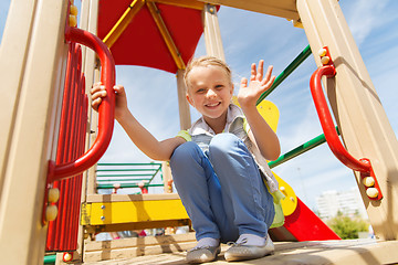 Image showing happy little girl climbing on children playground