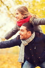 Image showing smiling couple having fun in autumn park