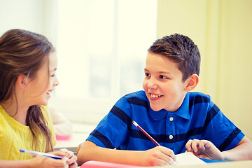 Image showing group of school kids writing test in classroom