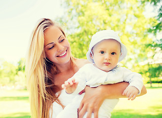 Image showing happy mother with little baby in park