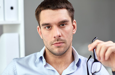 Image showing portrait of businessman with eyeglasses at office