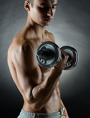 Image showing young man with dumbbell