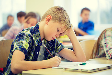 Image showing group of school kids writing test in classroom