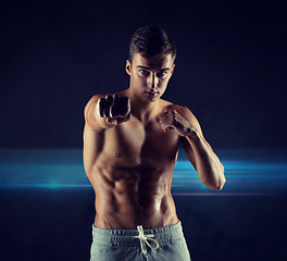 Image showing young man in fighting or boxing position