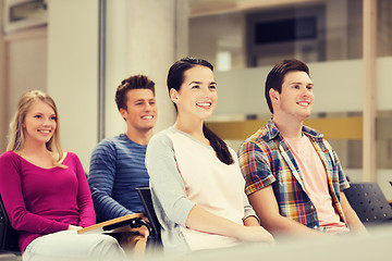 Image showing group of smiling students in lecture hall