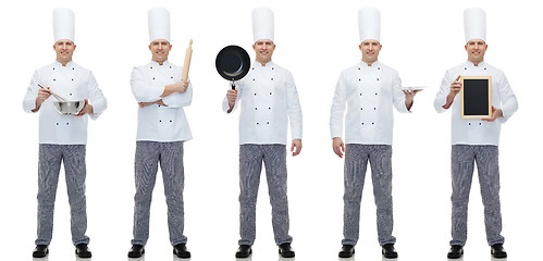 Image showing happy male chef cook holding blank menu board