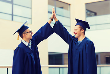 Image showing smiling students in mortarboards
