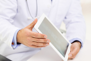 Image showing close up of male doctor hands with tablet pc