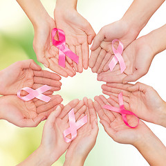 Image showing close up of hands with cancer awareness symbol