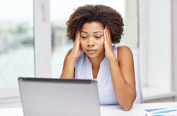 Image showing african woman with laptop at office