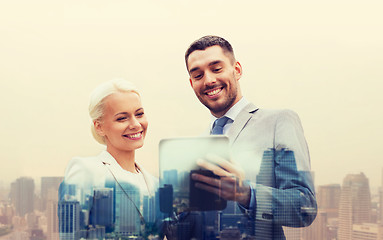 Image showing smiling businessmen with tablet pc in city