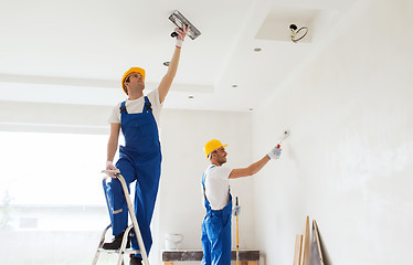 Image showing group of builders with tools indoors