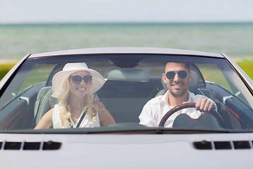 Image showing happy man and woman driving in cabriolet car