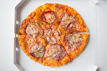 Image showing close up of pizza in paper box on table