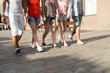 Image showing close up of teenage friends walking in city